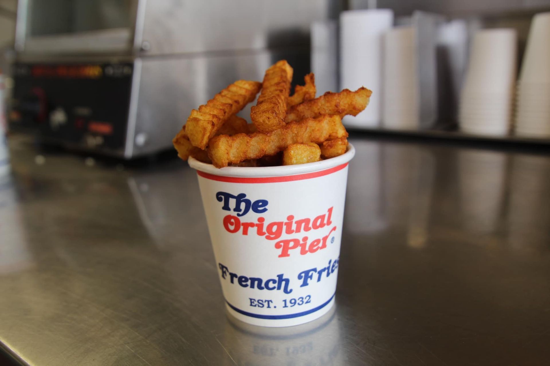 A cup of french fries from the original pier