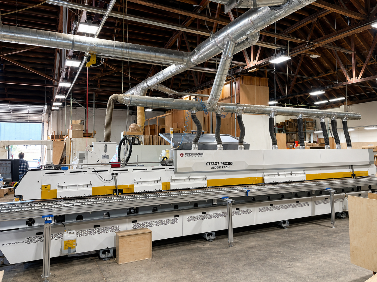 Large industrial machine edgeband with metal ducting in a factory warehouse ceiling space
