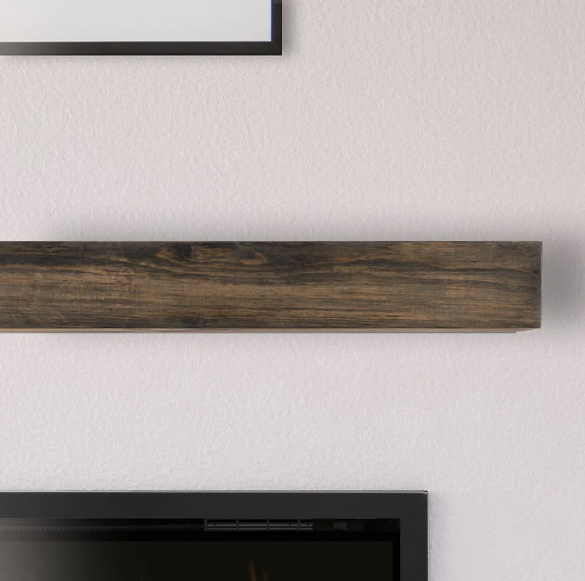 Floating brown wooden shelf mounted on a white wall above a TV.