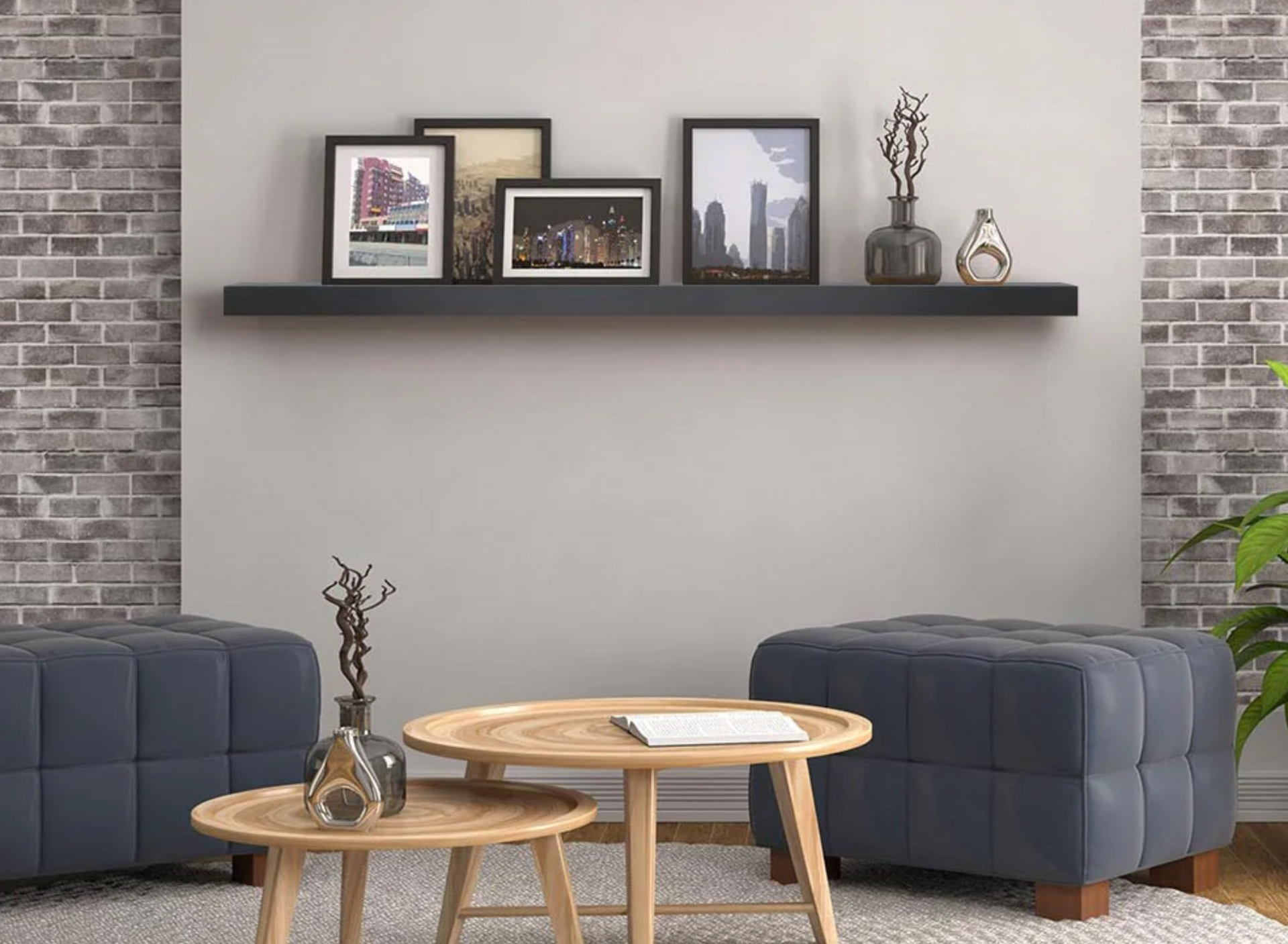 Living room with gray accents, artwork on a shelf above ottomans and wooden tables.