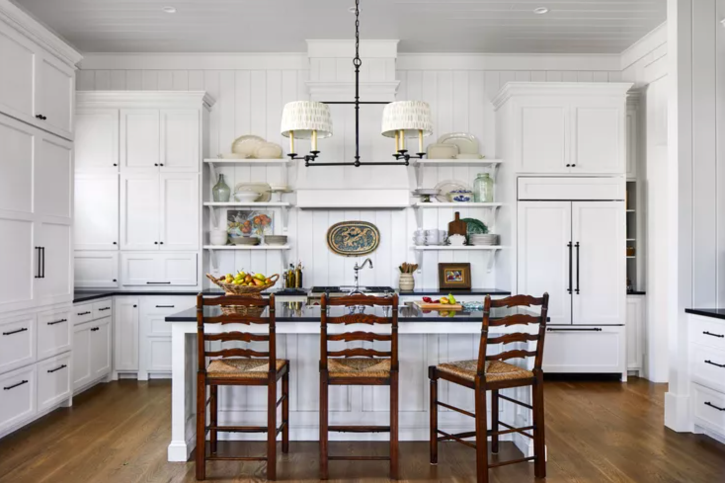 Bright white modern kitchen with island and custom cabinetry in Portland.