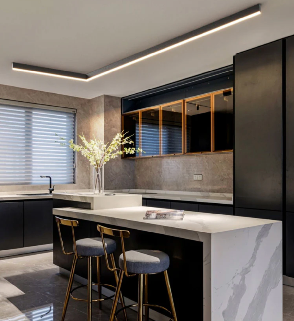 Modern black and wood kitchen with under-cabinet lighting and sleek finishes