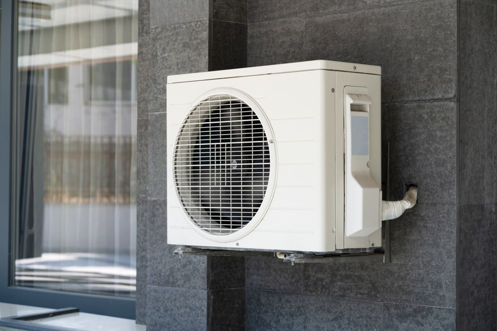 White Air Conditioner On A Wall — Air Conditioner in Macksville, NSW