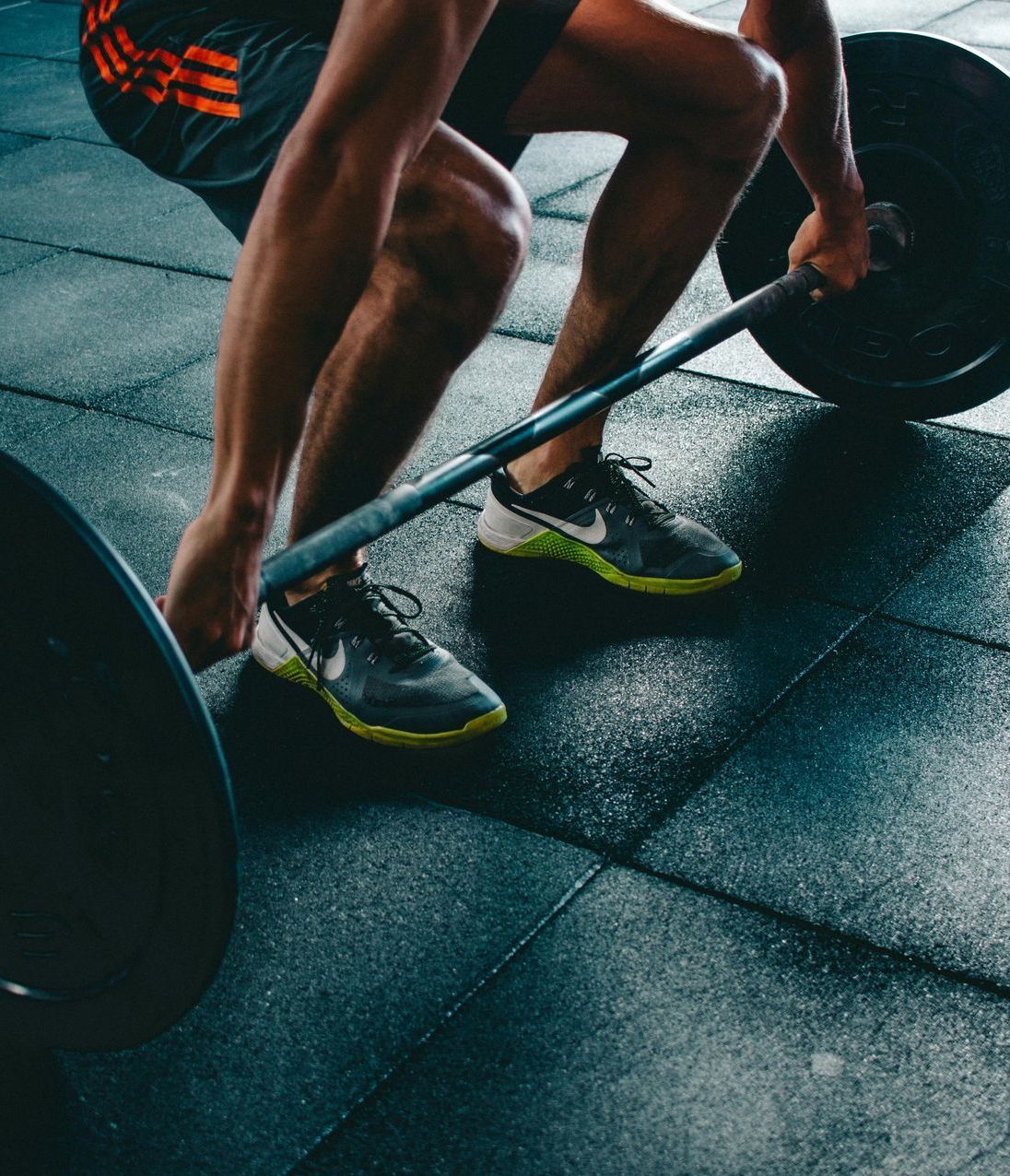 Man training with improved energy and strength through TRT at Boston Beautox