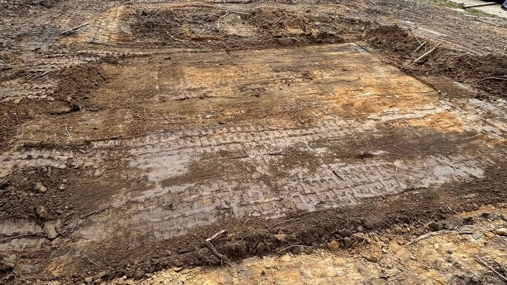 Professional backyard excavation and grading for a new paver patio by Tayeb's Landscaping in Chesterfield County, VA.