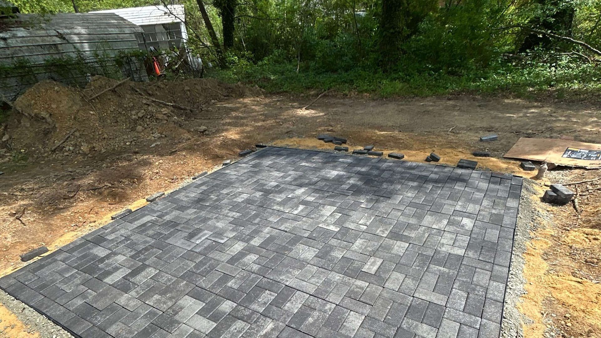 Completed custom paver patio installation with premium pavers by Tayeb's Landscaping in Chesterfield, VA.