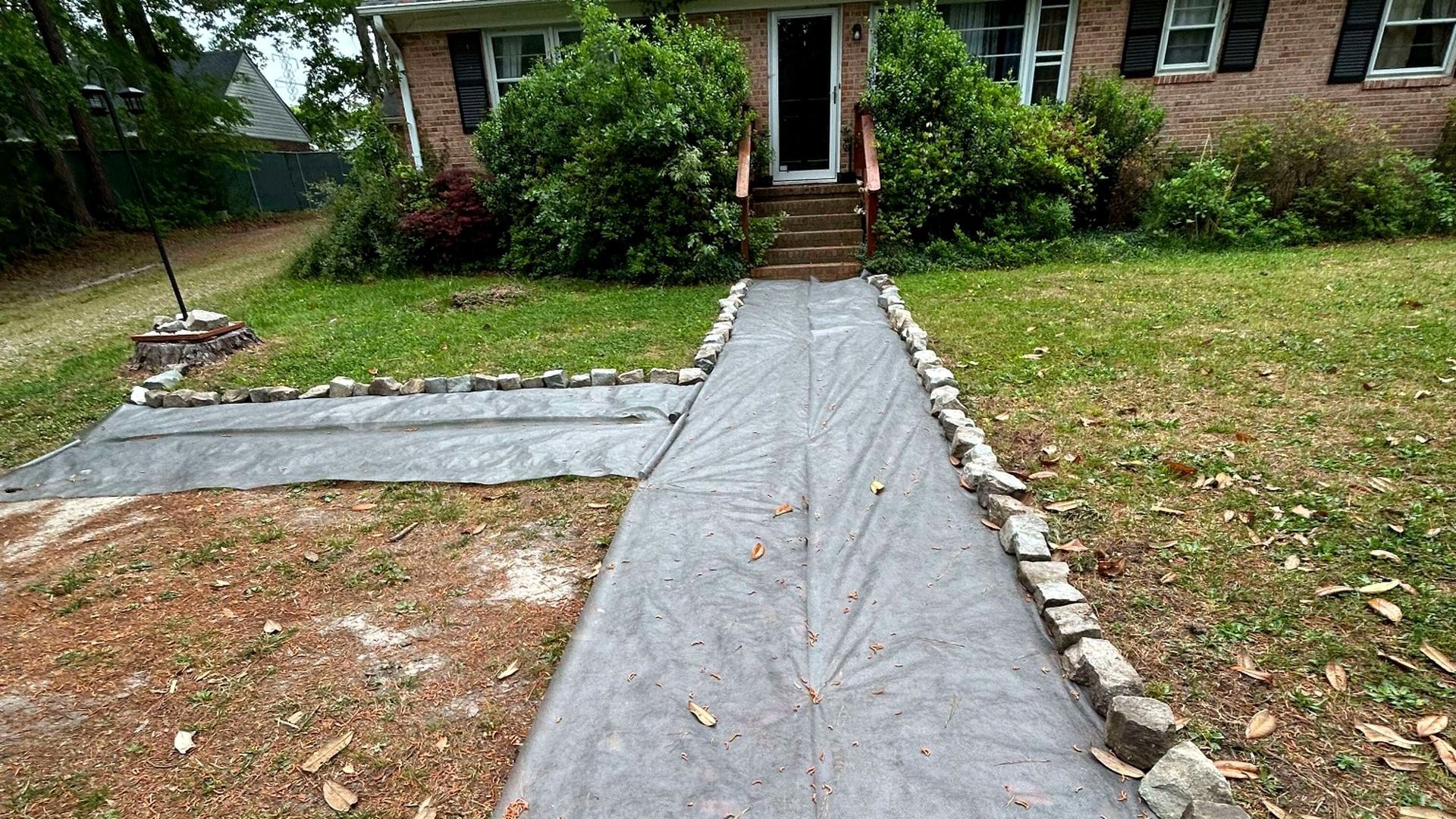 Gravel driveway preparation before stone installation in Chesterfield, VA