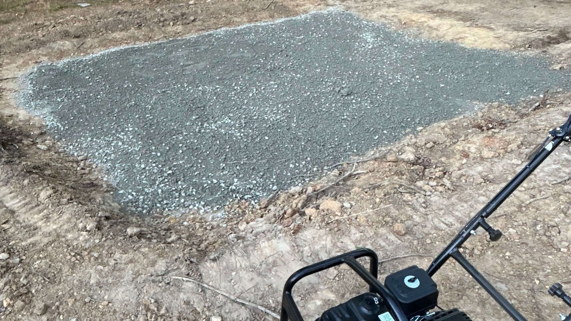 Compacted gravel base installation for a custom paver patio by Tayeb's Landscaping in Chesterfield County, VA.