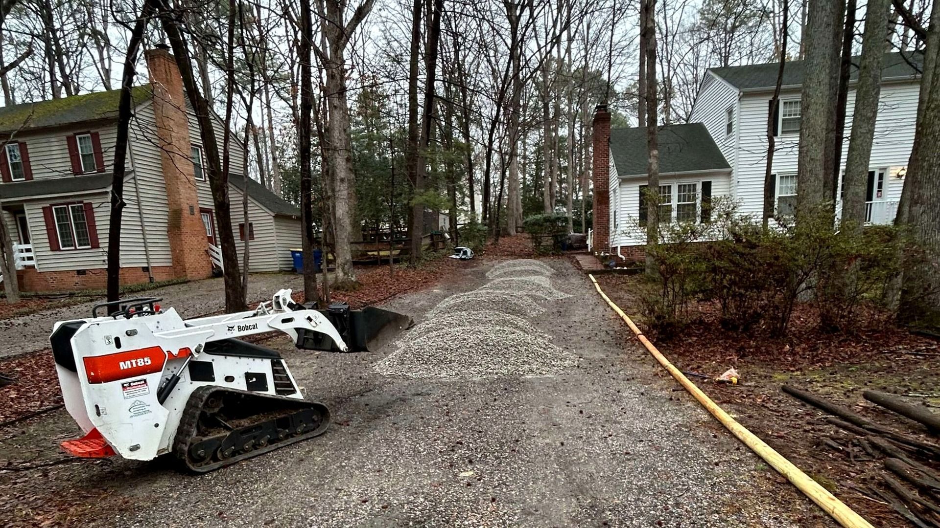 Existing gravel driveway before resurfacing and fresh stone installation in Chesterfield, VA.