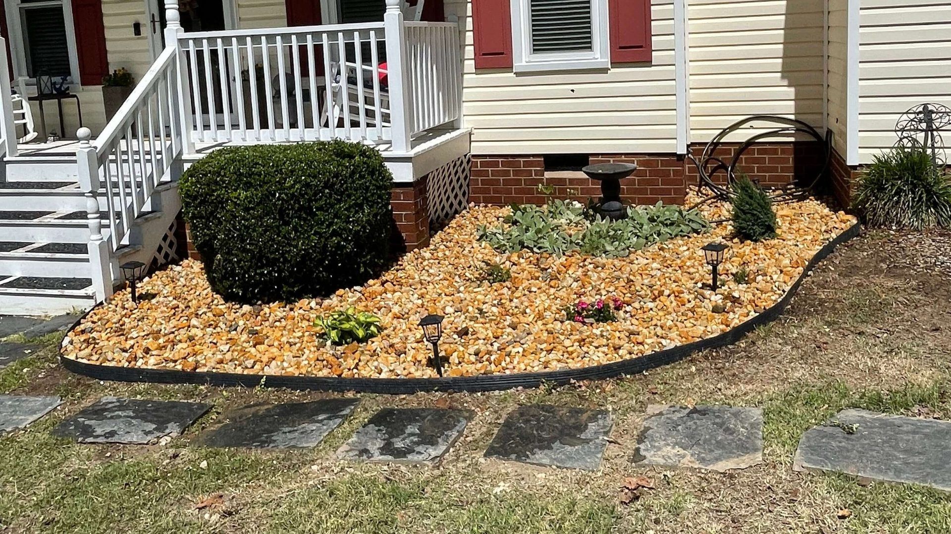 Stone walkway and landscaped front yard by Tayeb's Landscaping in Chesterfield, VA
