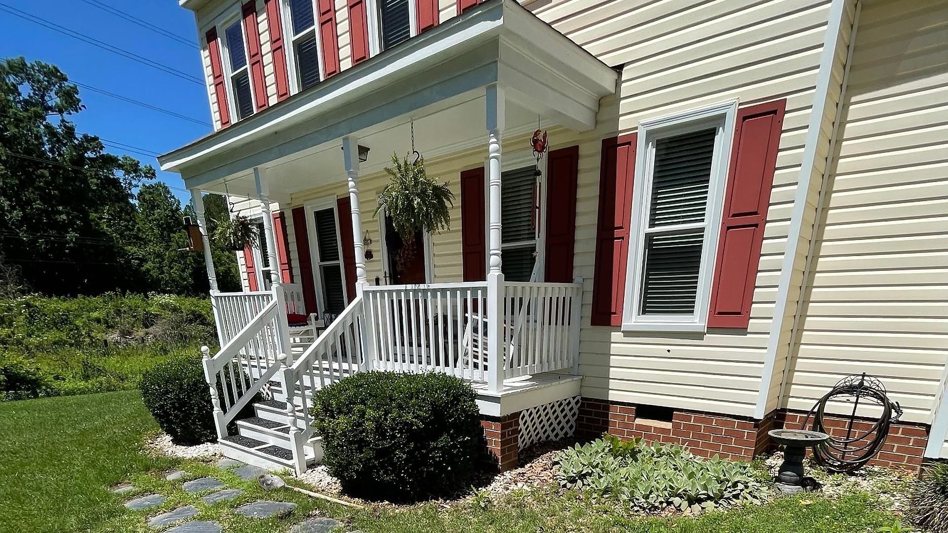Stone walkway and landscaped front yard by Tayeb's Landscaping in Chesterfield, VA