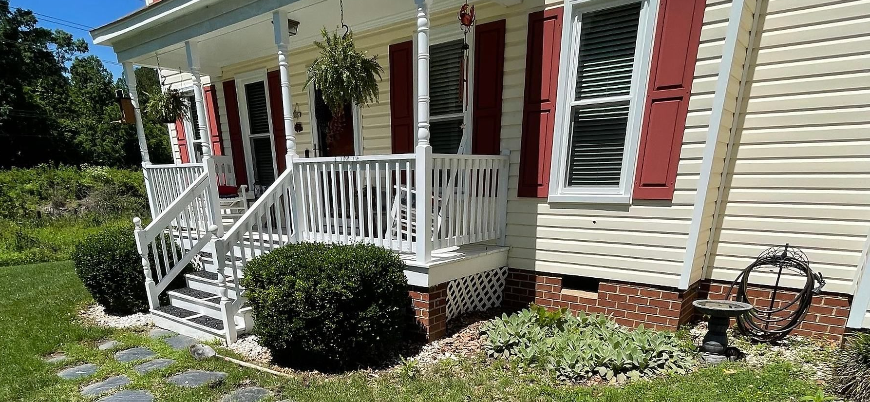 Stone walkway and landscaped front yard by Tayeb's Landscaping in Chesterfield, VA