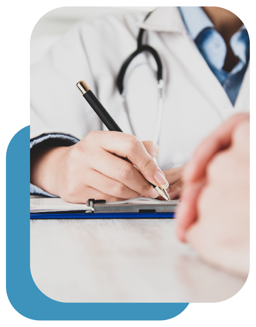 A doctor is writing on a clipboard with a pen