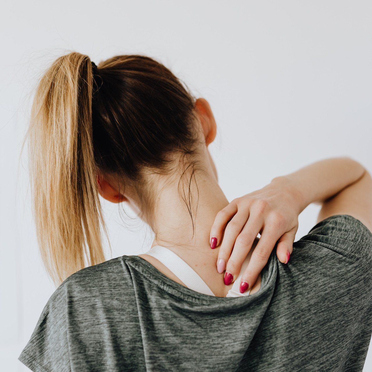 A woman has skincare on her neck.