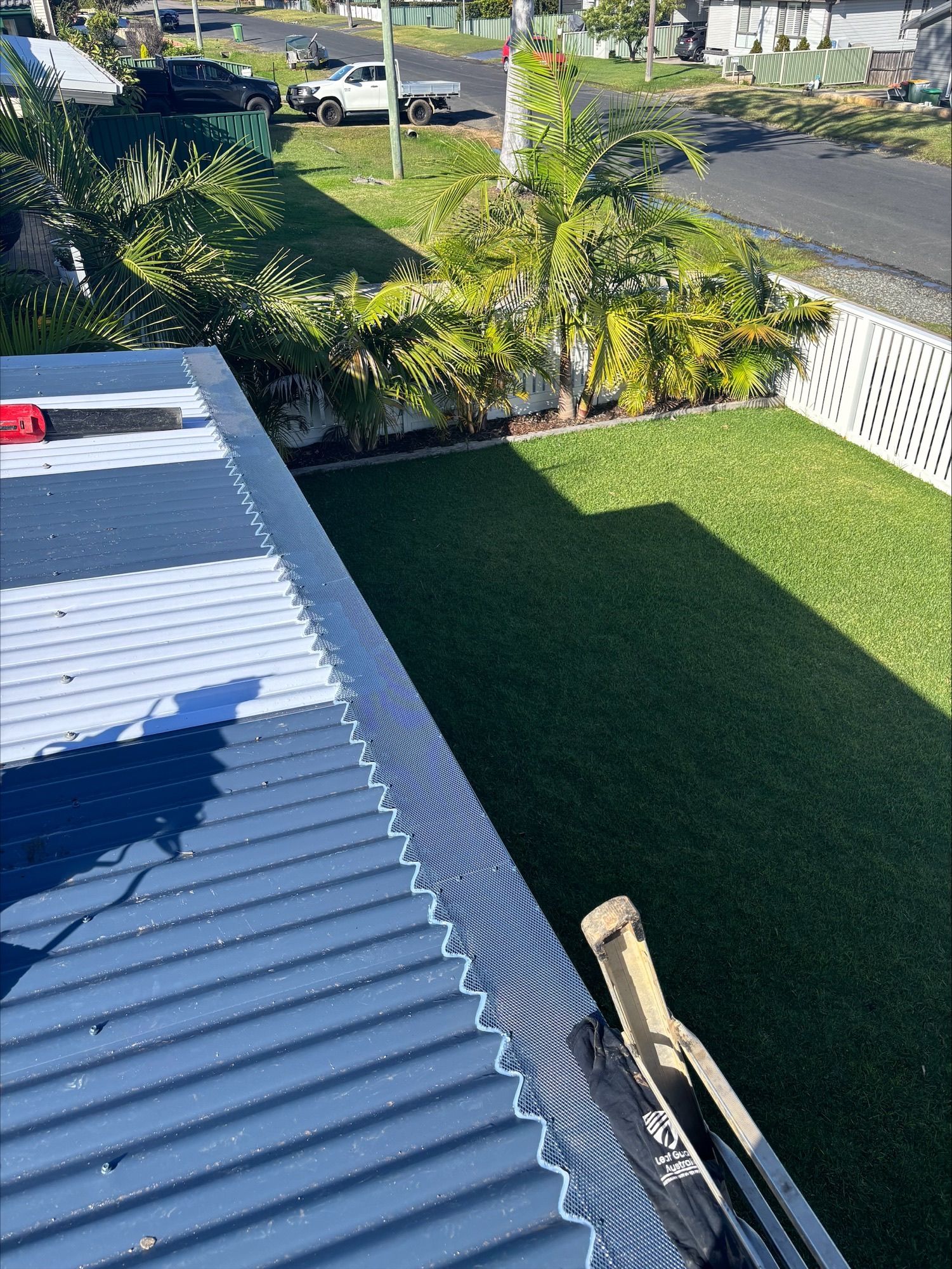 A Close Up of a Gutter With a Mesh Cover on It — Norwest Roof Restorations In Central Coast, NSW