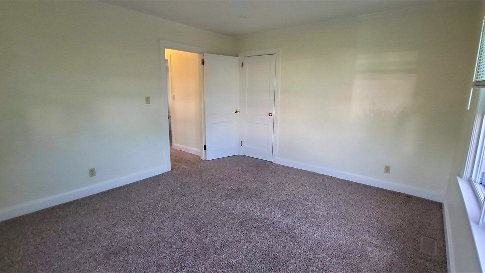 Inlet apartment bedroom door to bathroom