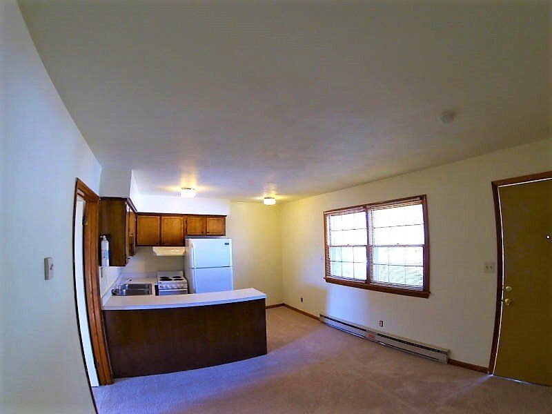 3rd Bay St Apartments kitchen and living area