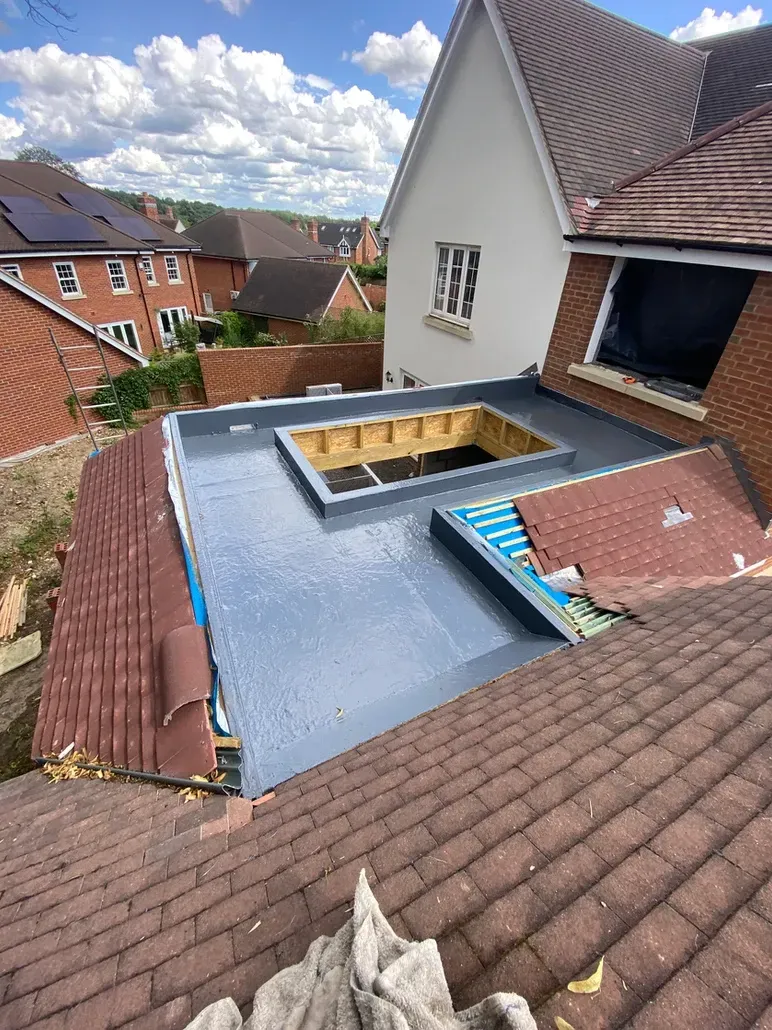 A house with a roof that is being remodeled.