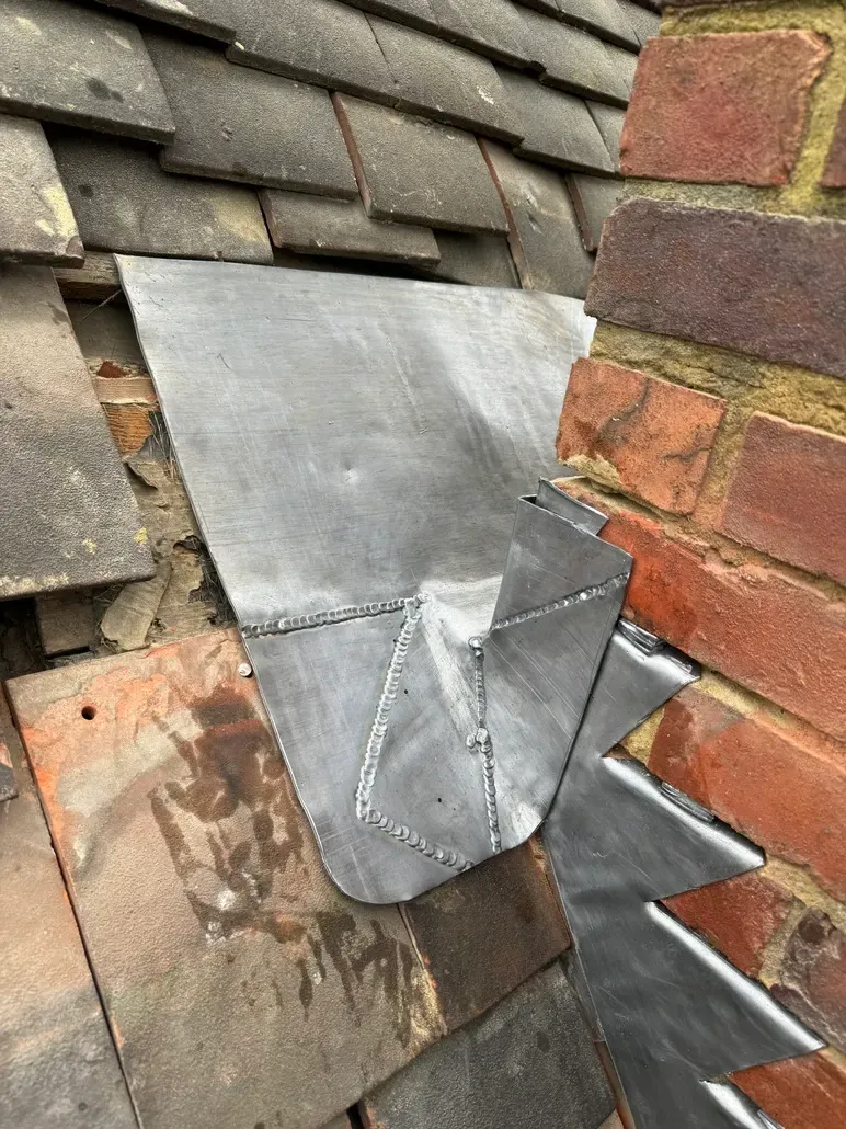 lead flashing on the side of a chimney