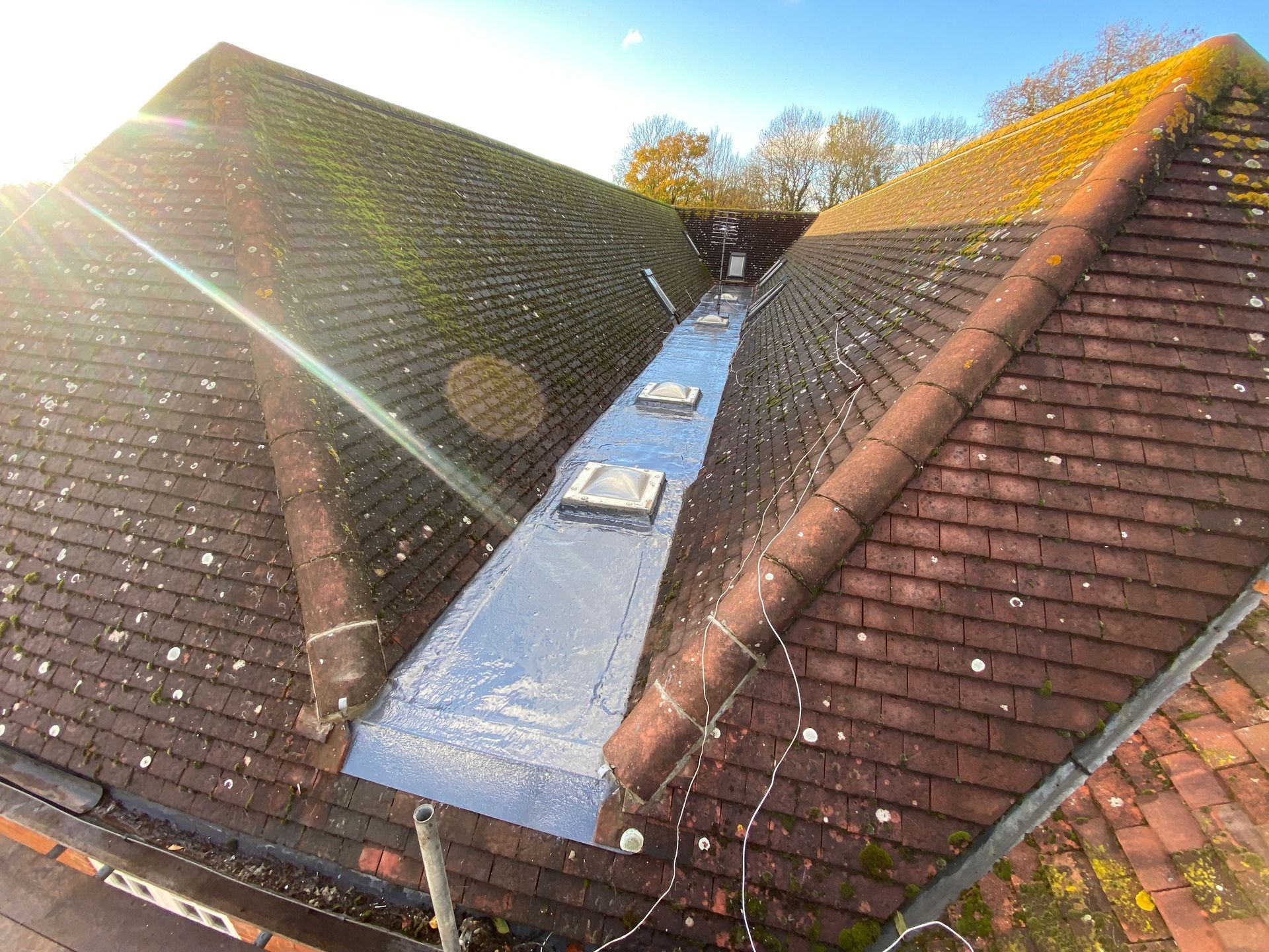 a close up of a roof with a drain on it .