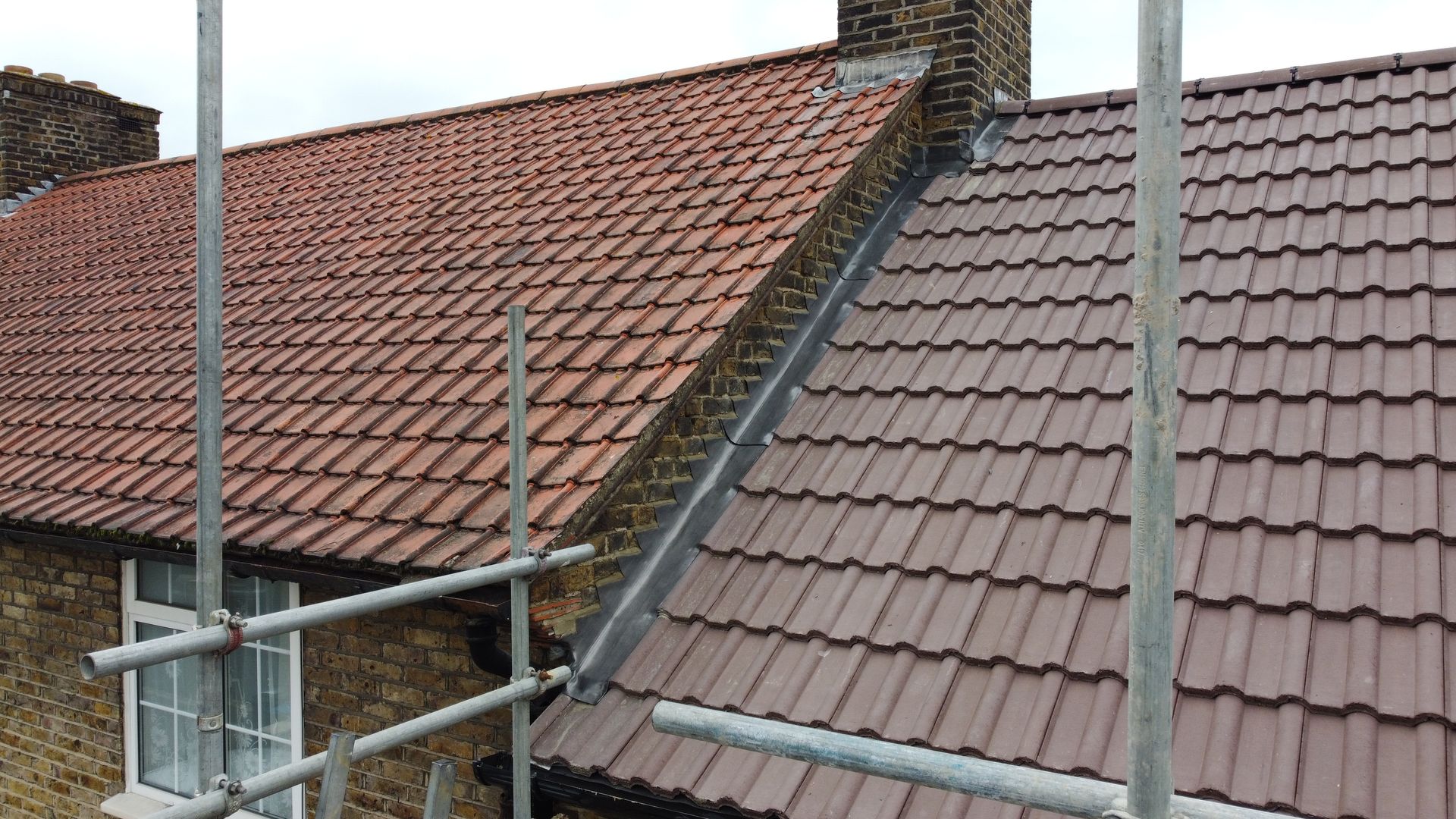 a roof with a chimney and scaffolding on it .