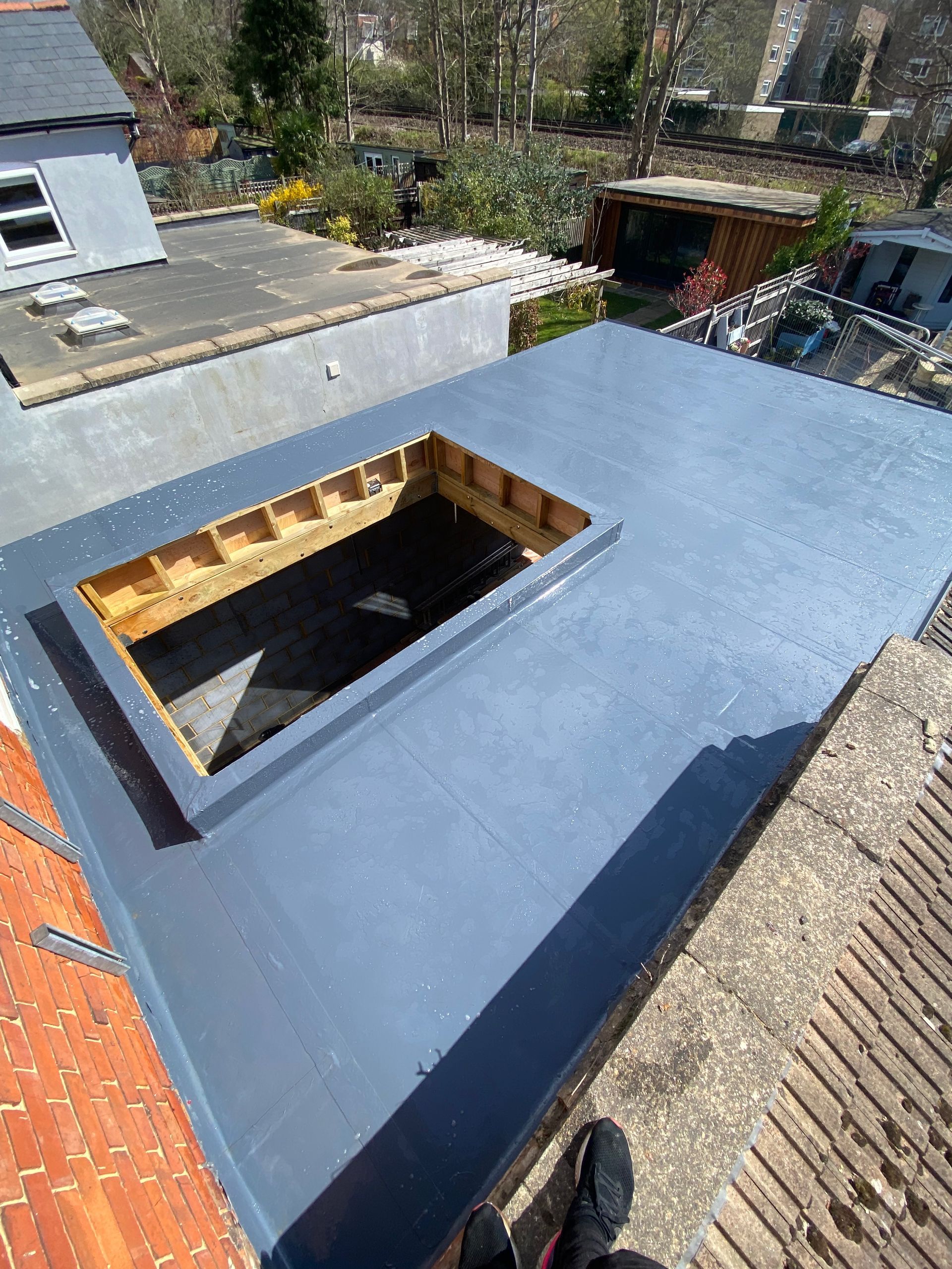a roof with a hole in it and a window .