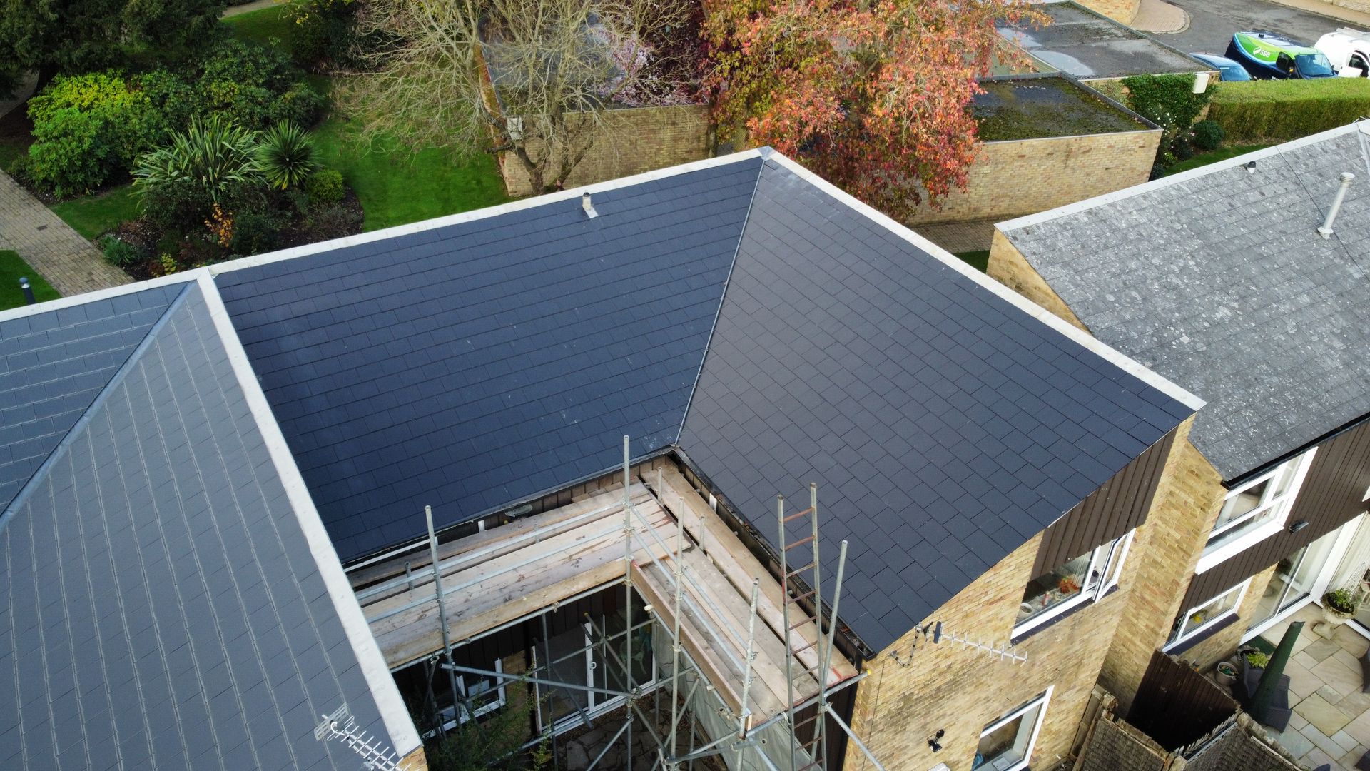 an aerial view of a building with a roof that is being built .