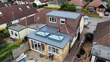 modern home with new roof on extension at rear of house