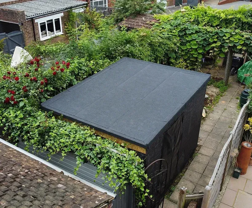 small building with flat felt roof