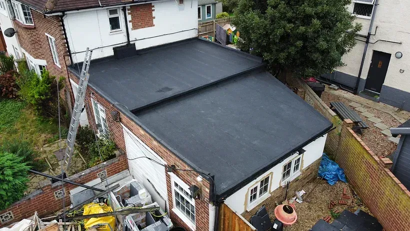aerial view of rear of property with flat roof