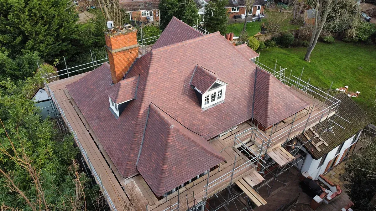 Complex, new tiled roof on a large residential property in Egham Hill. Surrey