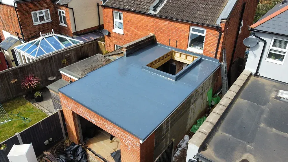 large flat single ply roof under construction