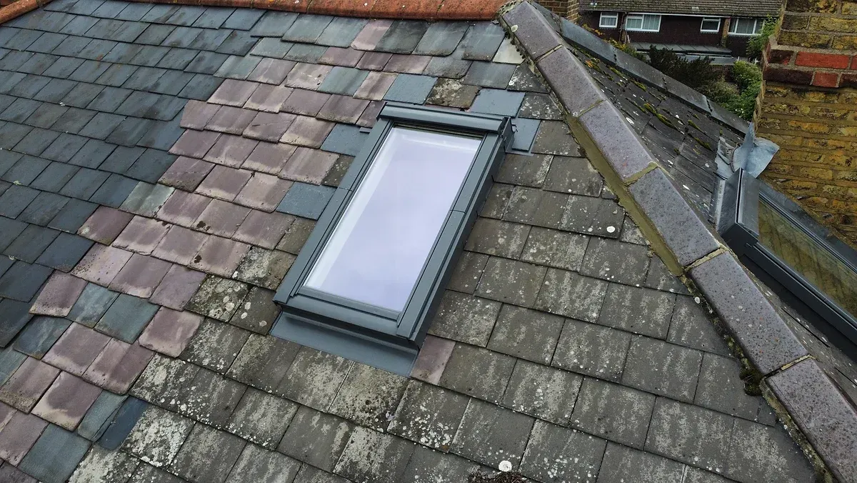 velux window in old slate roof