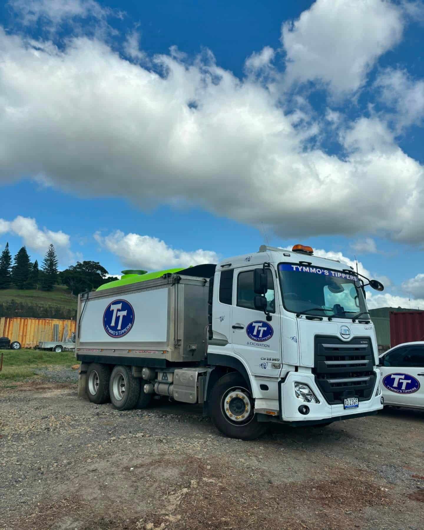 A White Dump Truck Is Parked In A Gravel Lot — Tymmo's Tippers In West Ballina, NSW
