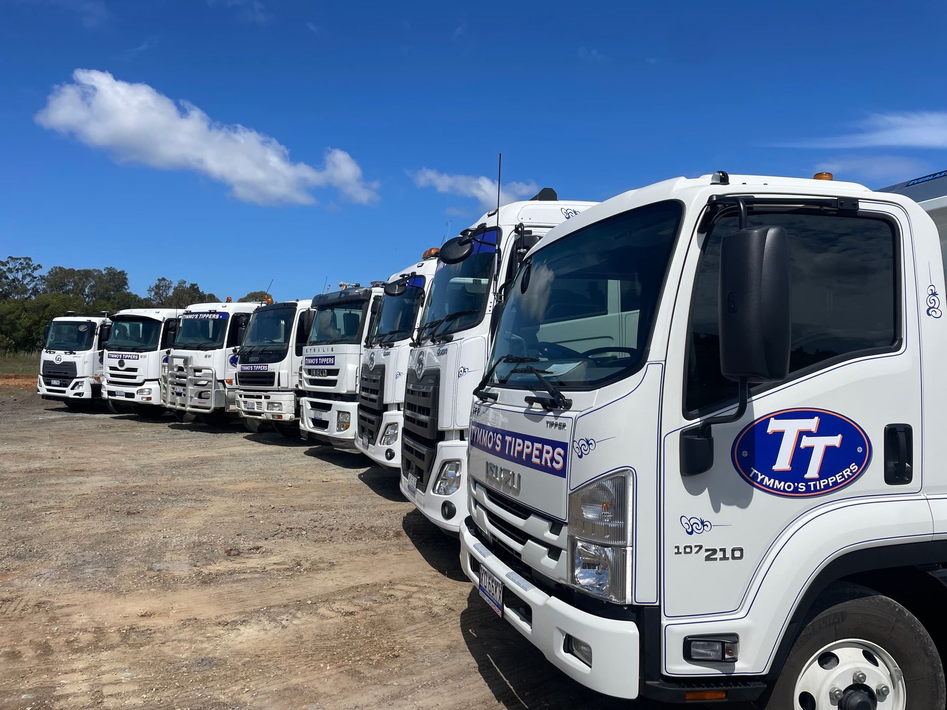 A Row of Tipper Trucks Are Parked On The A Road — Tymmo's Tippers In West Ballina, NSW