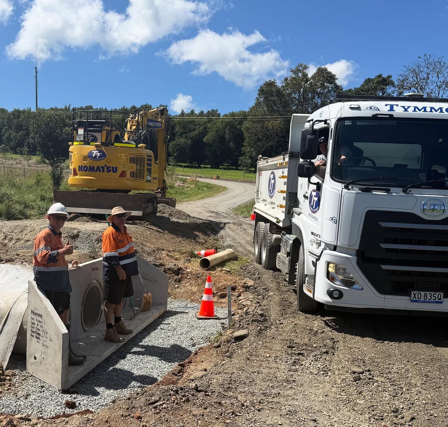 Roadwork with a white tipper truck and excavator for Tipper Truck Hire Byron Bay.