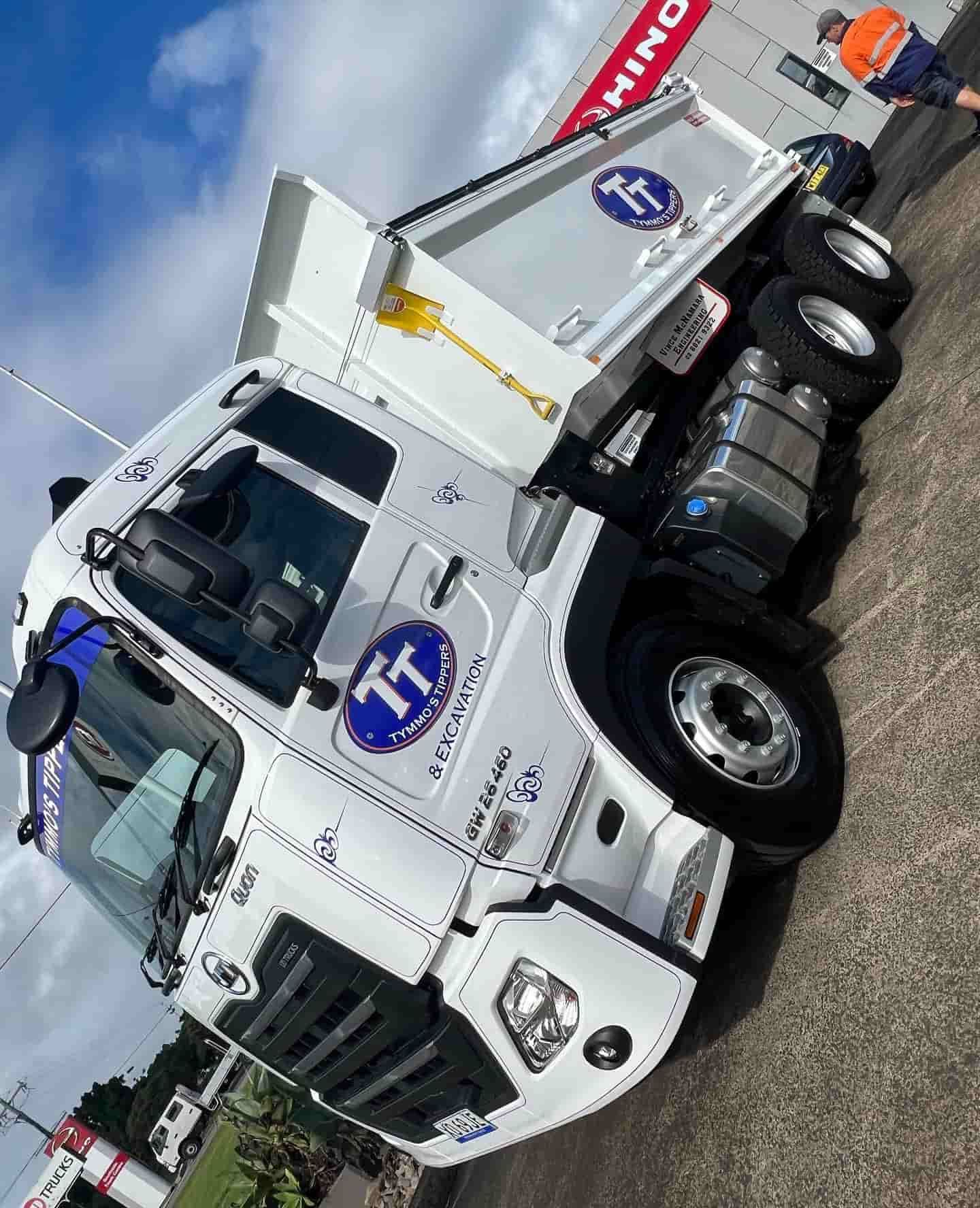 A White Dump Truck Is Parked On The Side Of The Road — Tymmo's Tippers In Yamba, NSW