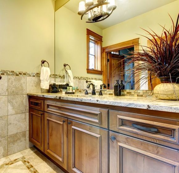 beautiful stained walnut bathroom vanity with mirror for customer in Chattanooga