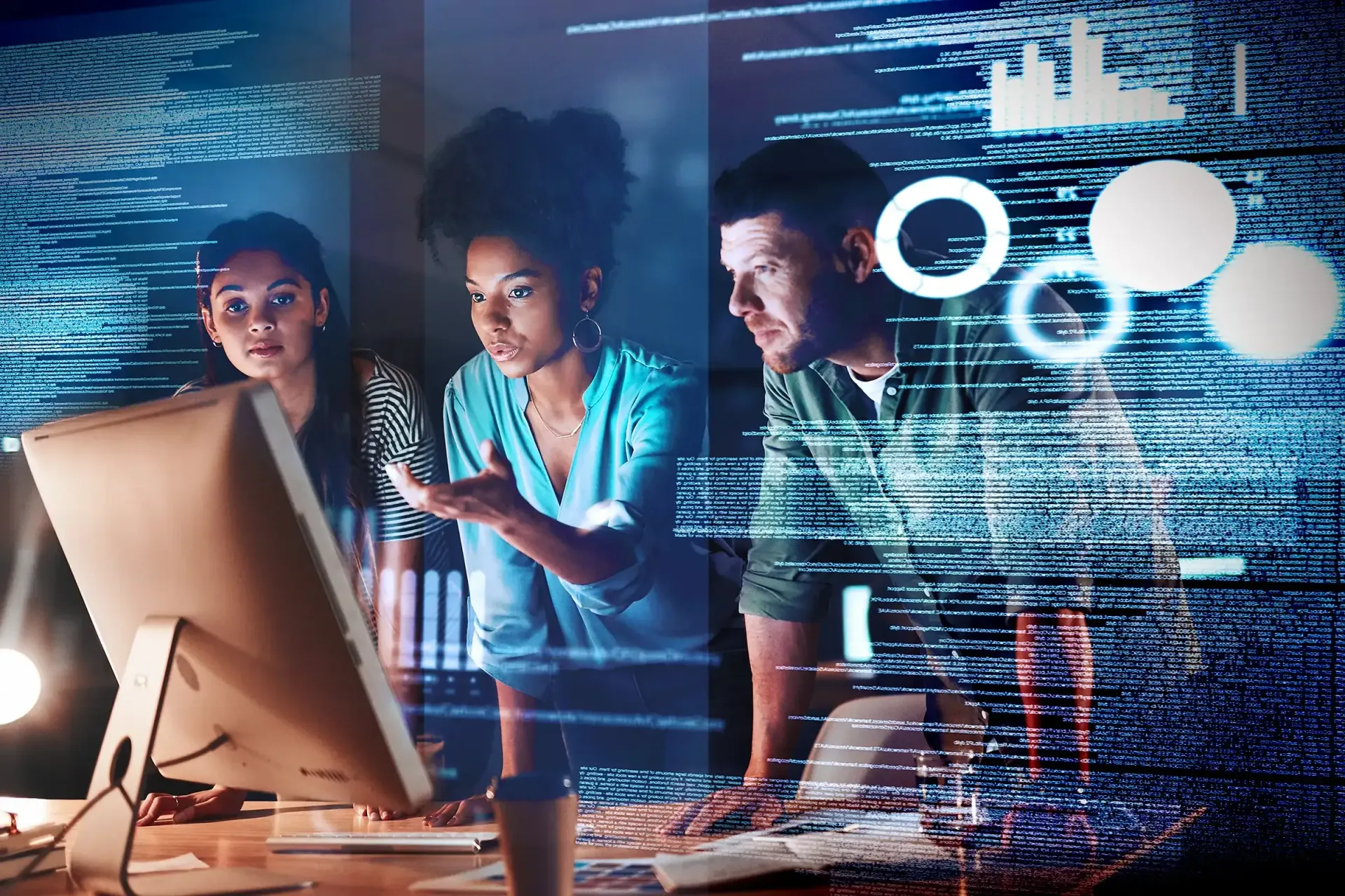 A group of people are looking at a computer screen.