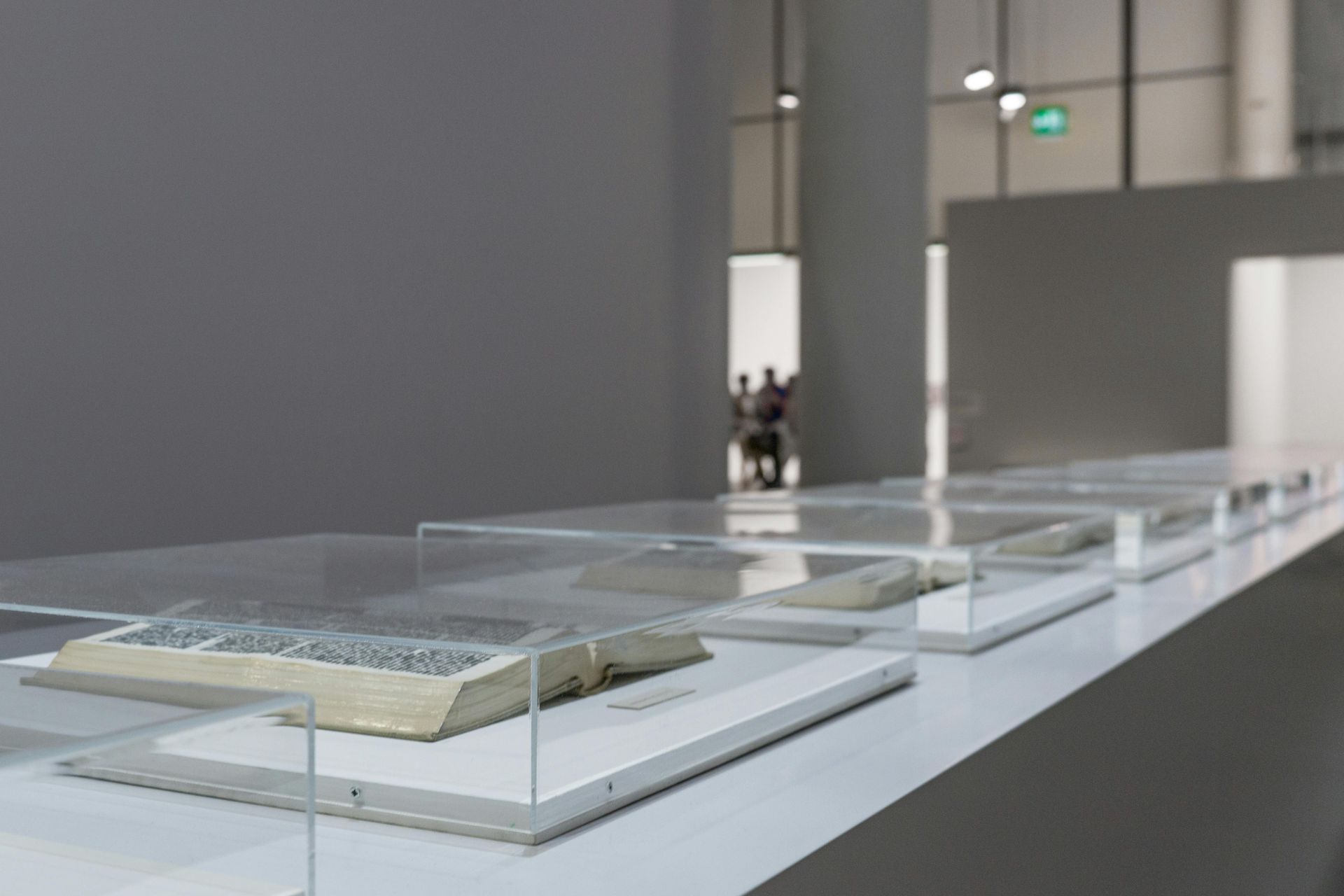 Archival documents encased in glass.