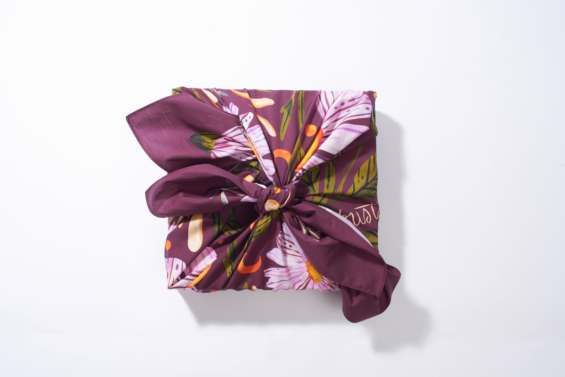 a pair of notebooks with a floral pattern on them
