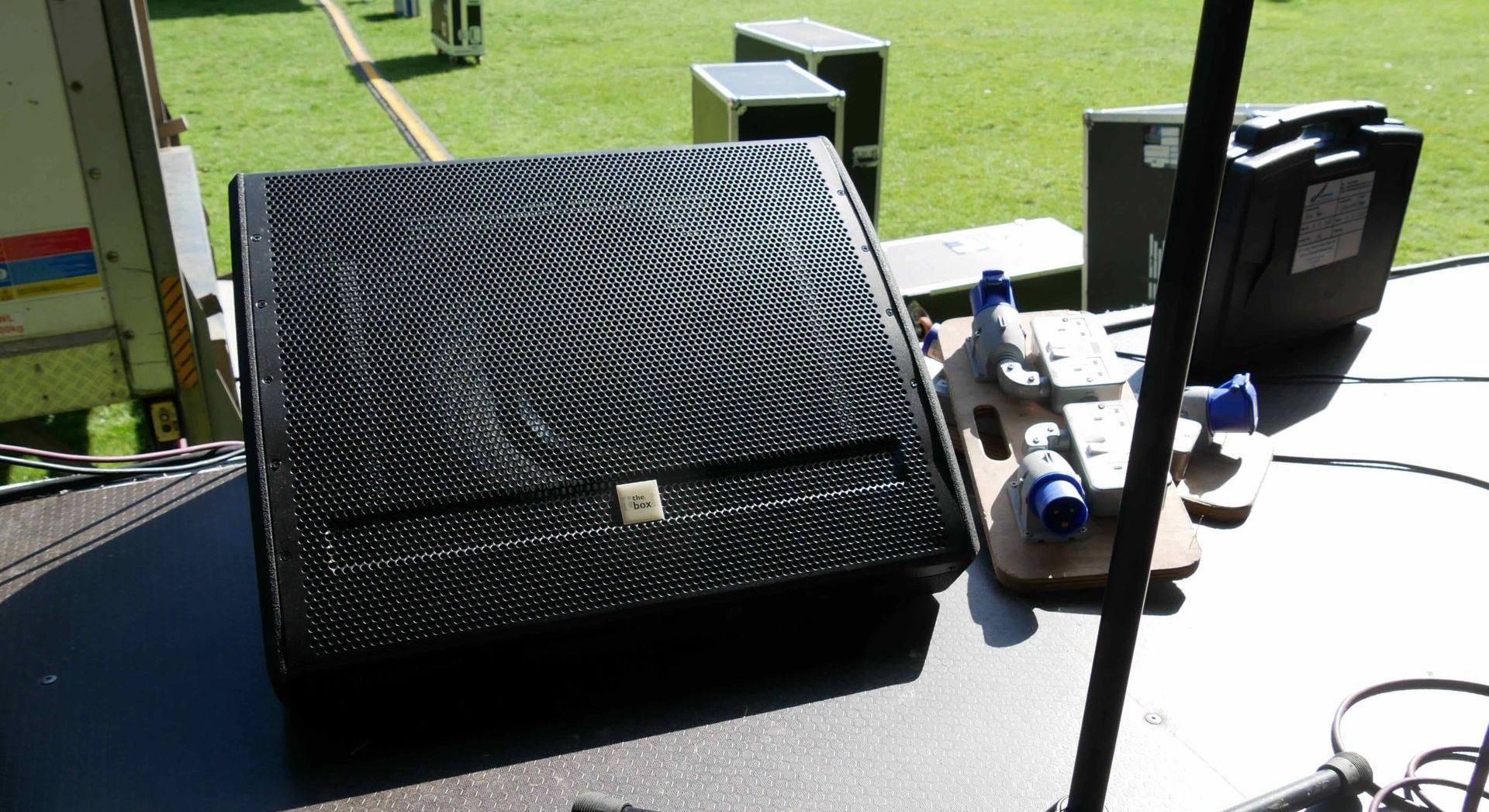 A close up of a stage speaker.