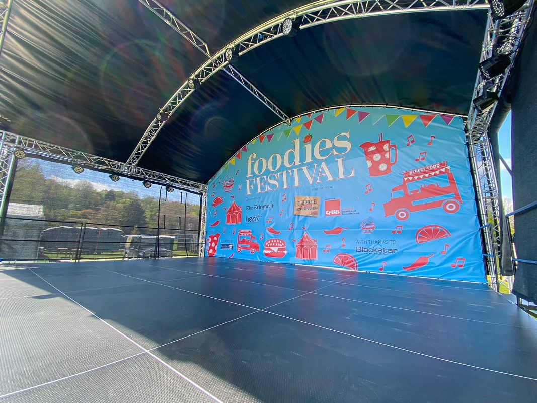 Arc roof stage set up for the outdoor Foodie event