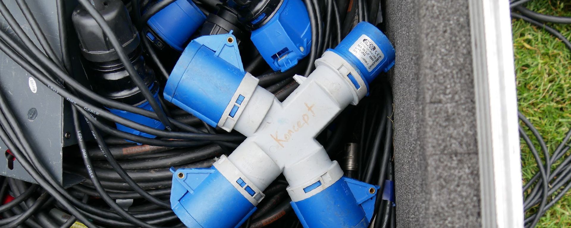 Outdoor plug sockets in a flight case on top of cables