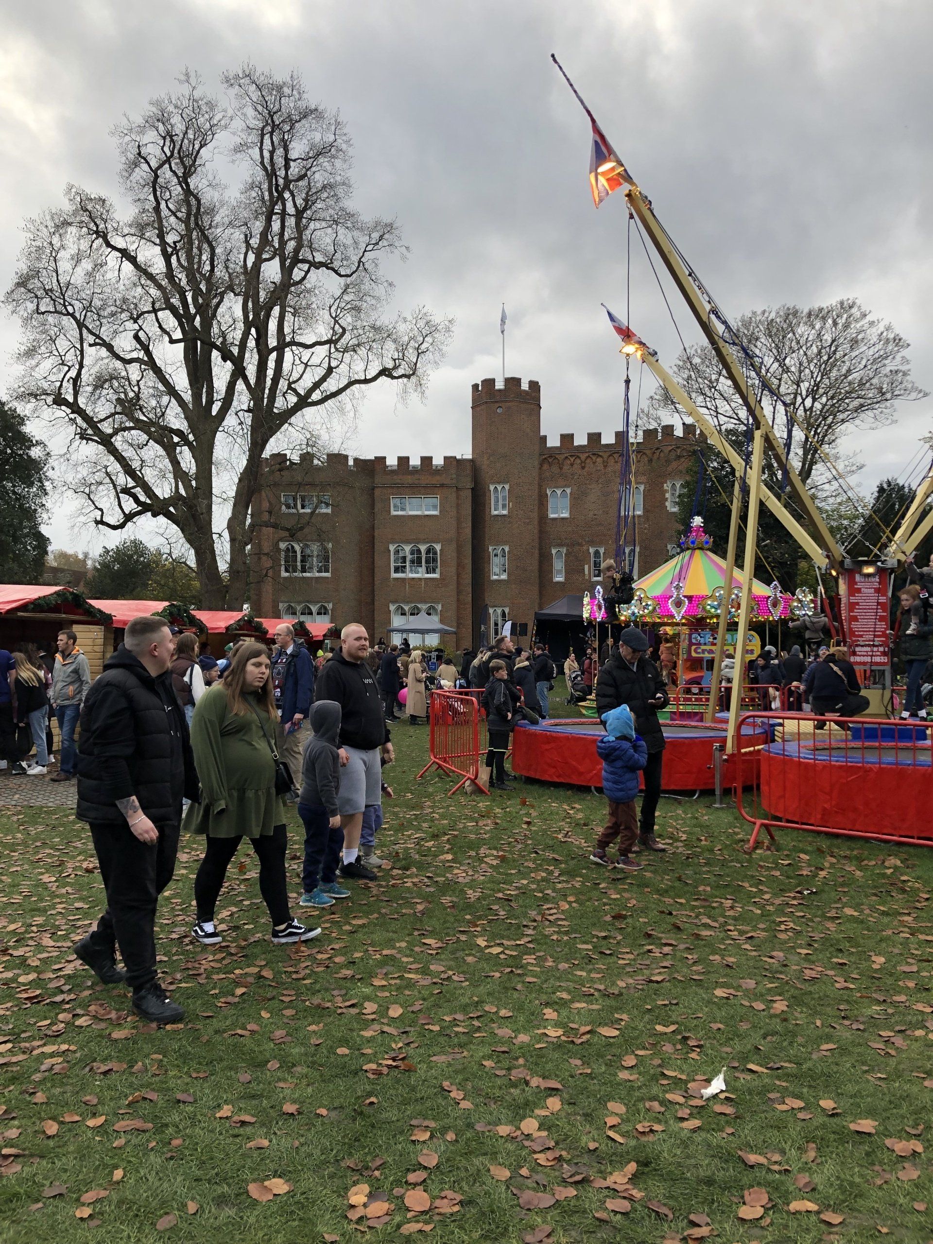 Hertford Castle with a funfair in front of it