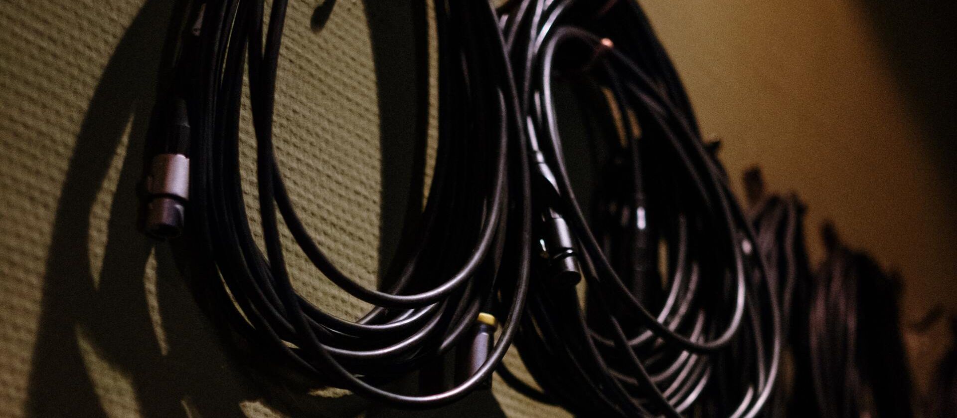 Cables coiled and hung up on hooks