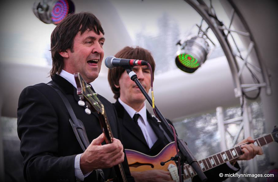 close us of two singers on an inflatable roofed stage