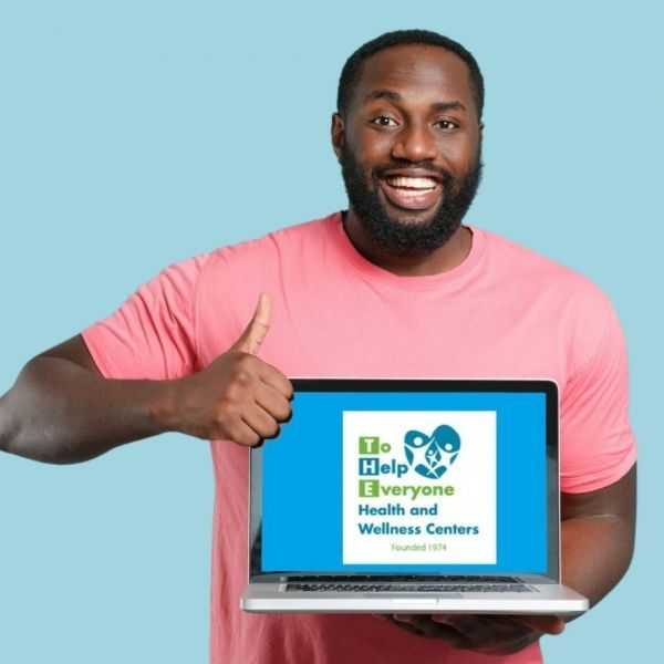 Man holding laptop with 