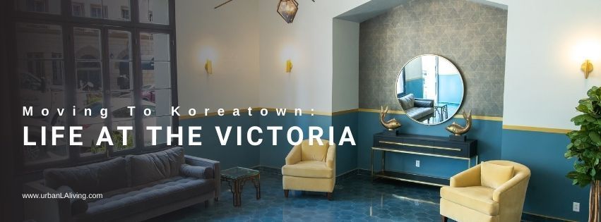 Lobby with seating, decor, and large mirror. Text 