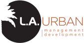 Logo for L.A. Urban: black circle with palm tree silhouette, 